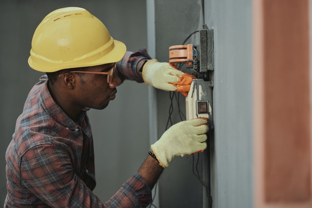 worker doing maintenance work in a commercial building